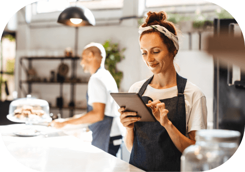 Waitress Working On Tablet