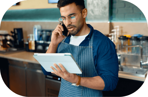 Barista comparing electricity on tablet